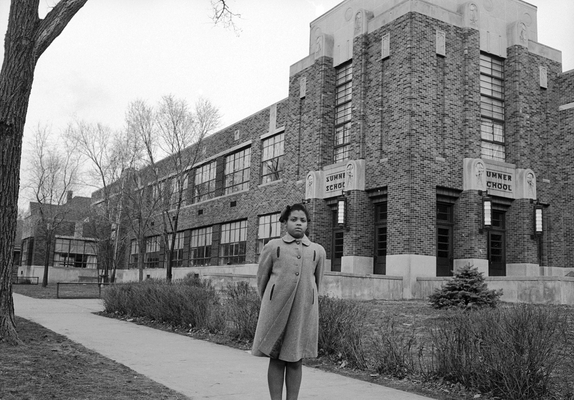 Portrait of nine-year-old African-American student Linda Brown as she poses outside Sumner Elementary School, Topkea, Kansas, 1953. When her enrollment in the racially segregated school was blocked, her family initiated the landmark Civil Rights lawsuit 'Brown V. Board of Education,' that led to the beginning of integration in the US education system. (Photo by Carl Iwasaki/The LIFE Images Collection/Getty Images)